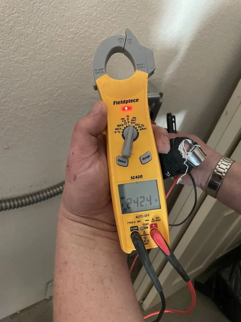 Voltage testing with clamp meter during Electrical Installation Services in Artesia